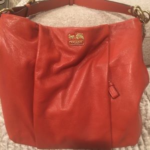 Orange Coach crossbody bag